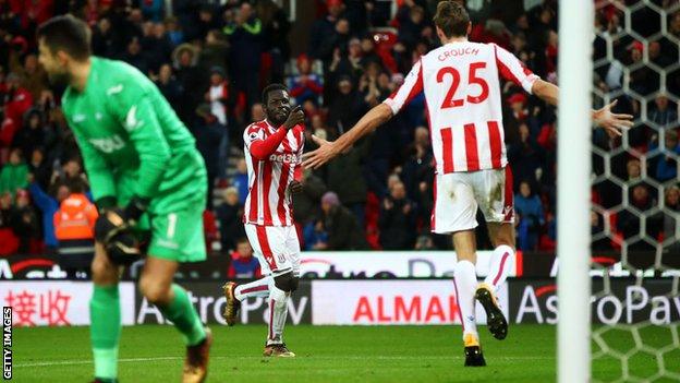 Diouf celebrates with Peter Crouch