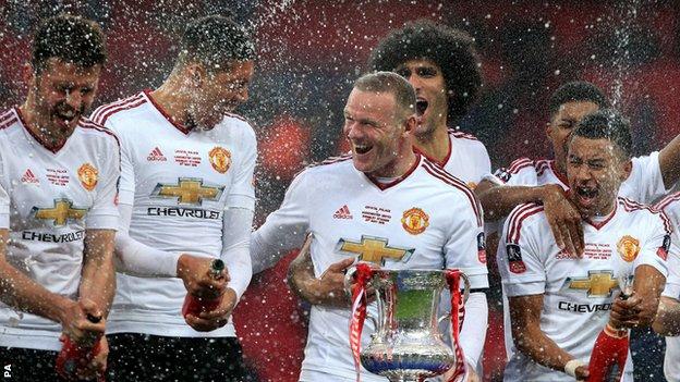 Wayne Rooney celebrates winning the FA Cup