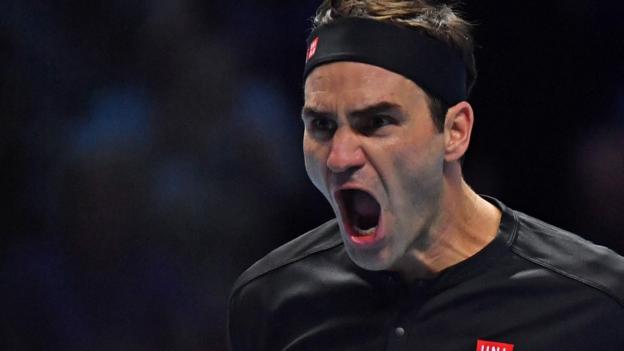 Superb Federer beats Djokovic to reach ATP Finals semis