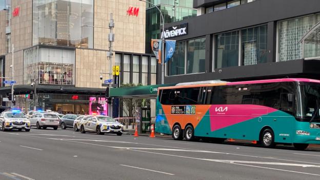 A Fifa Women's World Cup bus parked inside a police cordon in Auckland city centre following a nearby shooting