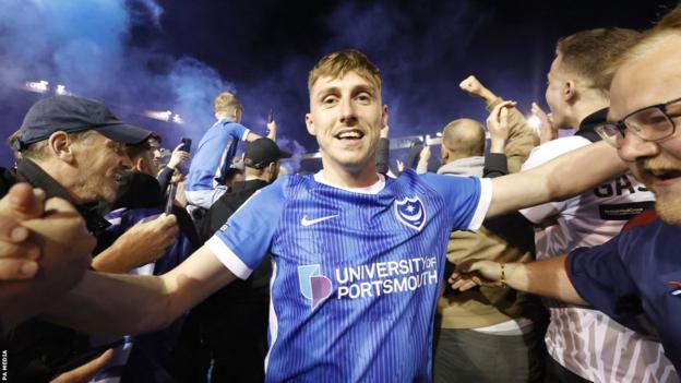 Portsmouth's Gavin Whyte celebrates promotion with supporters