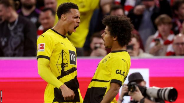 Borussia Dortmund's Karim Adeyemi celebrates with team-mate Felix Nmecha