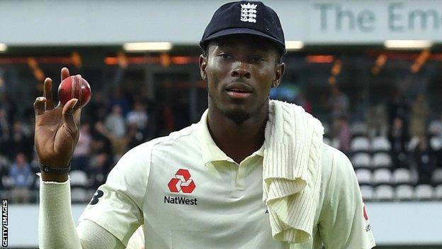 England fast bowler Jofra Archer holds up the ball to the crowd as he walks off after taking 6-45 against Australia
