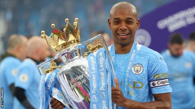 Manchester City's Fernandinho pictured with the Premier League trophy in 2021