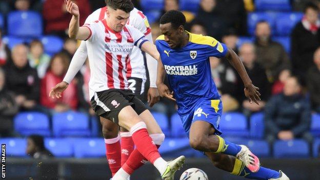AFC Wimbledon have re-signed striker Zach Robinson on two-year deal