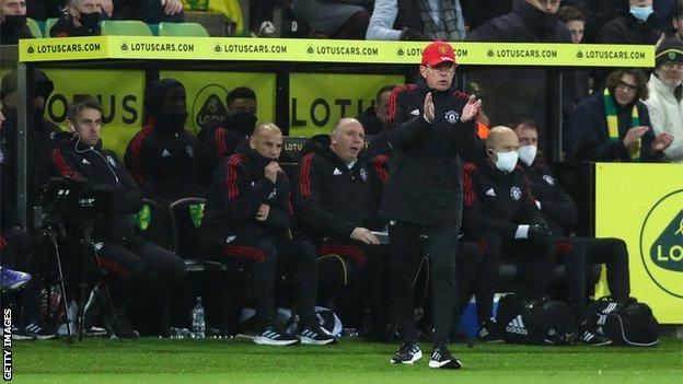 Manchester United staff on the sidelines