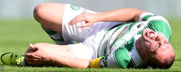 Celtic's Scott Brown writhes in pain