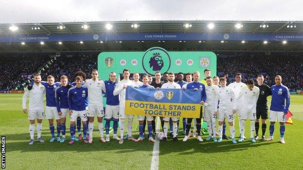 Leicester and Leeds players took part in a minute's applause before Saturday lunchtime's Premier League game