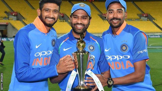 Khaleel Ahmed, Rohit Sharma and Mohammad Siraj with the ODI series trophy