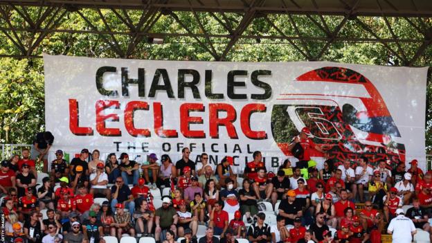 A banner supporting Charles Leclerc astatine  the 2022 Italian Grand Prix