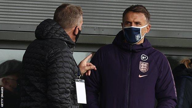 England manager Phil Neville watches a Women's Super League game