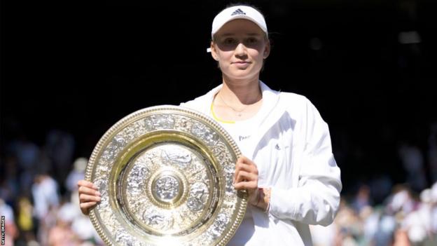 Elena Rybakina holding the Wimbledon trophy