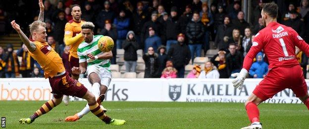 Celtic's Scott Sinclair has a shot saved by Motherwell's Trevor Carson