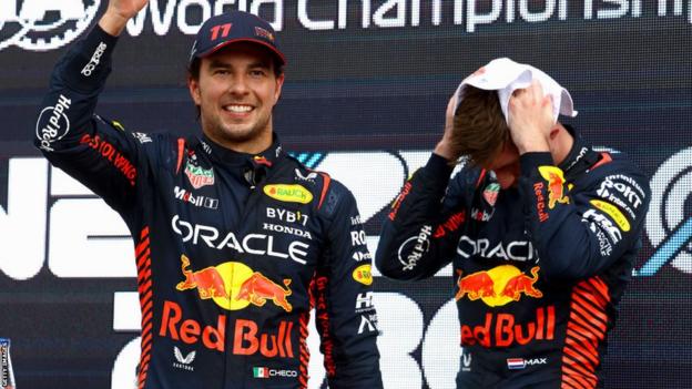 Sergio Perez celebrates his win in the Azerbaijan Grand Prix with team-mate Max Verstappen drying his hair with a towel behind him