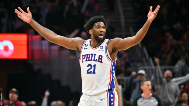 Philadelphia's Joel Embiid throws his arms in the air during the 76ers' win over the Cleveland Cavaliers