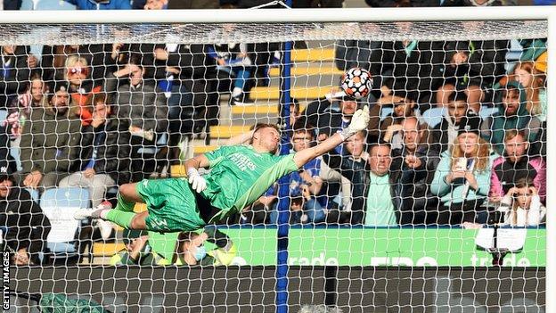 Arsenal goalkeeper Aaron Ramsdale appears to be kicked by