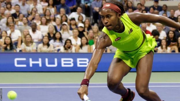 Coco Gauff stretches for a ball at the US Open