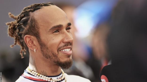 Lewis Hamilton smiles