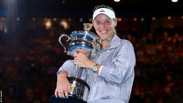 Caroline Wozniacki poses with the Australian Open trophy in 2018