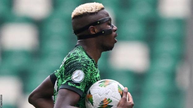 Victor Osimhen gestures during the Africa Cup of Nations (CAN) 2024 group A football match between Nigeria and Equatorial Guinea at the Alassane Ouattara Stadium in Ebimpe, Abidjan