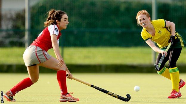Katie McGee of Pegasus attempts to block a pass from Railway Union's Anna May Whelan