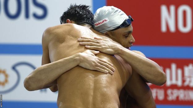 Ben Proud and Jordan Crooks embrace