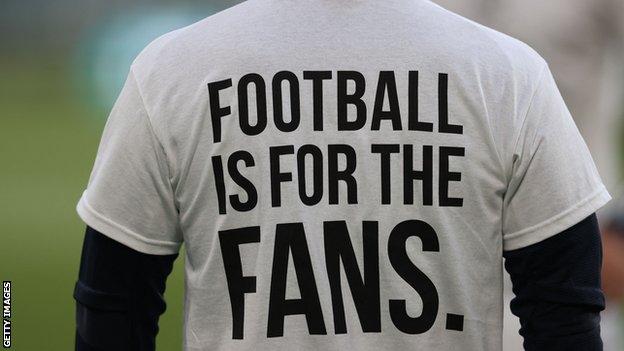 A t-shirt reading football is for the fans