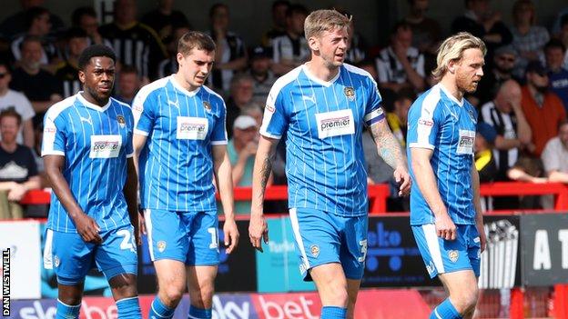 Notts County players look dejected after conceding an equaliser at Crawley