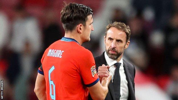 England's Harry Maguire and Gareth Southgate