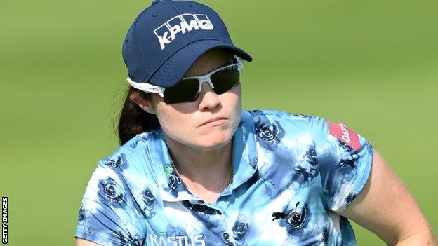 Leona Maguire keeps a close watch on her third shot at the 14th hole in the first round