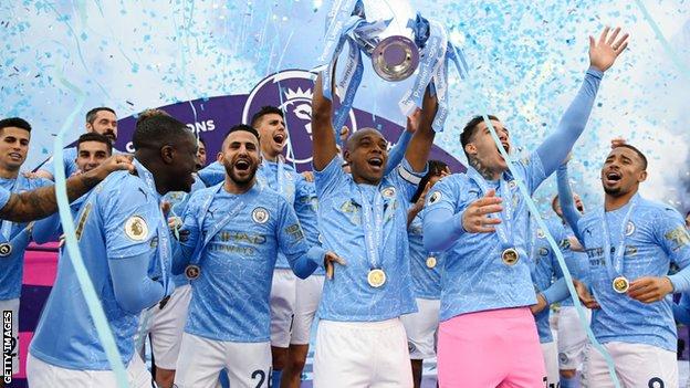 Manchester City with Premier League trophy