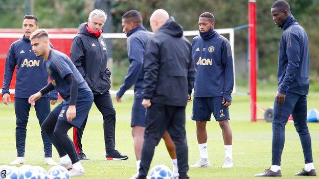 Manchester United, pictured here training, play Valencia in the Champions League on Tuesday