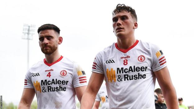 Tyrone players Padraig Hampsey and Conn Kilpatrick exit the field after the 2022 defeat by Derry