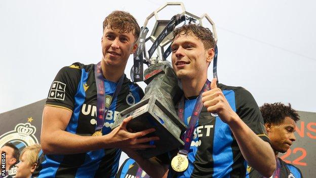 Jack Hendry (left) celebrates winning the league title with Club Bruges