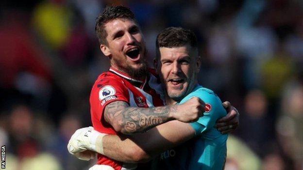 Lyanco and Fraser Forster celebrate Southampton's win over Arsenal