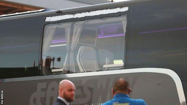 A smashed window on Real Madrid's team bus