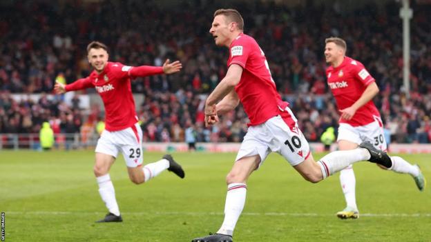 Paul Mullin celebrates his first goal against Boreham Wood