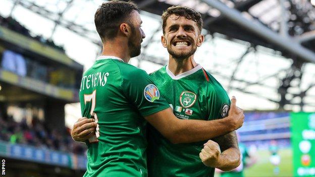 Robbie Brady celebrates his goal with Enda Stevens