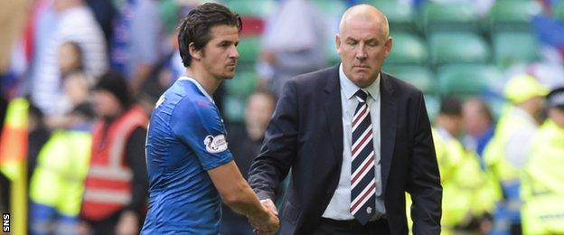 Joey Barton shakes hands with Rangers manager Mark Warburton