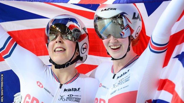 Sophie Thornhill and pilot Helen Scott hold a British flag aloft after winning gold in the women's tandem 1km time trial