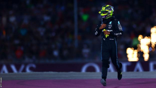 Lewis Hamilton crosses the track during a live race at the Qatar Grand Prix earlier this month