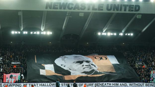 A banner in the stands in memory of Sir Bobby Robson on what would have been his 90th birthday before Newcastle's match with Liverpool