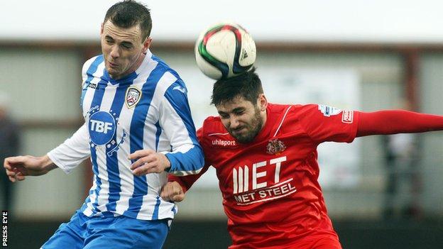 Coleraine's Darren McCauley challenges Portadown midfielder Sean Mackle