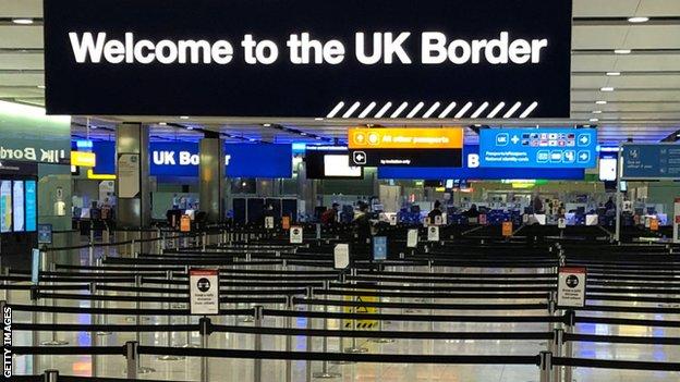 A UK border sign welcomes passengers on arrival at Heathrow airport