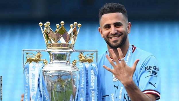 Manchester City's Riyad Mahrez with the Premier League trophy in 2023