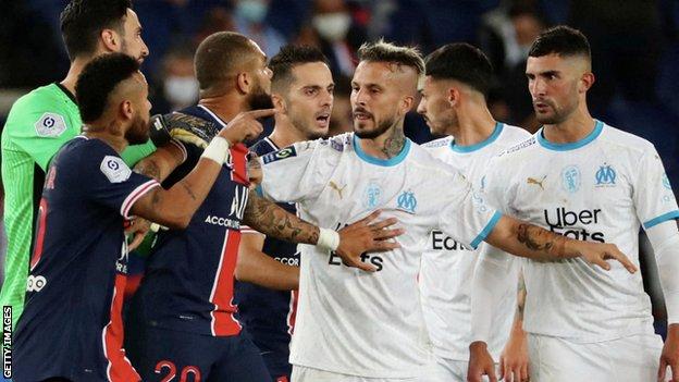 Alvaro Gonzalez and Neymar arguing, with the Brazilian forward pointing his finger at the Marseille player