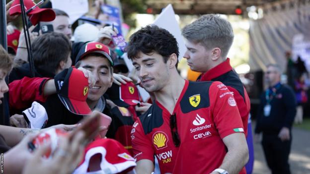 Charles Leclerc signing autographs and posing for photos with fans at the 2023 Australian Grand Prix