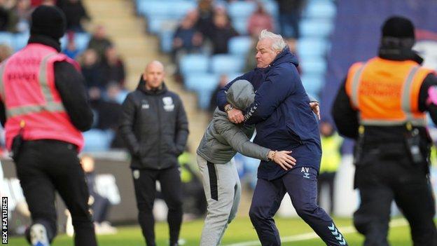 Coventry City assistant manager Adi Viveash got involved at the final whistle to tackle an unwanted pitch invader