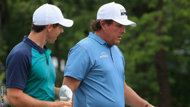 Rory McIlroy and Phil Mickelson chat during Tuesday's practice round at Bellerive
