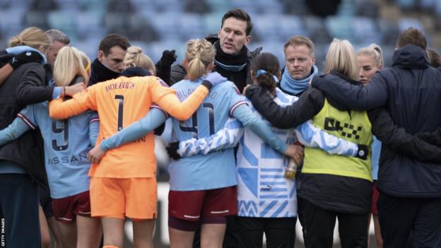 Manchester City players with Gareth Taylor